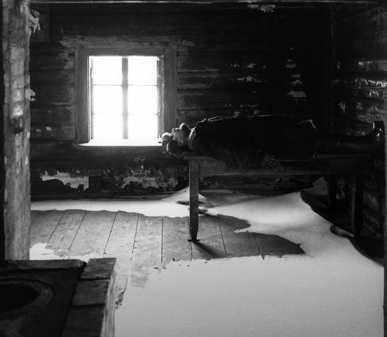 Interior of a country house and a sleeping person